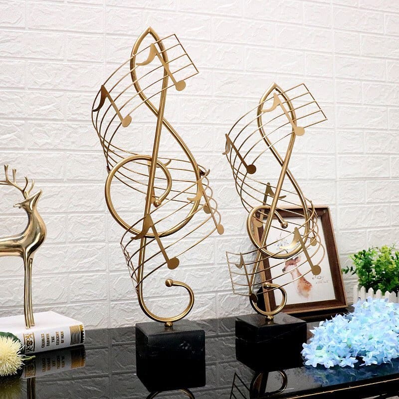 Gold circular tree sculpture styled on a living room table